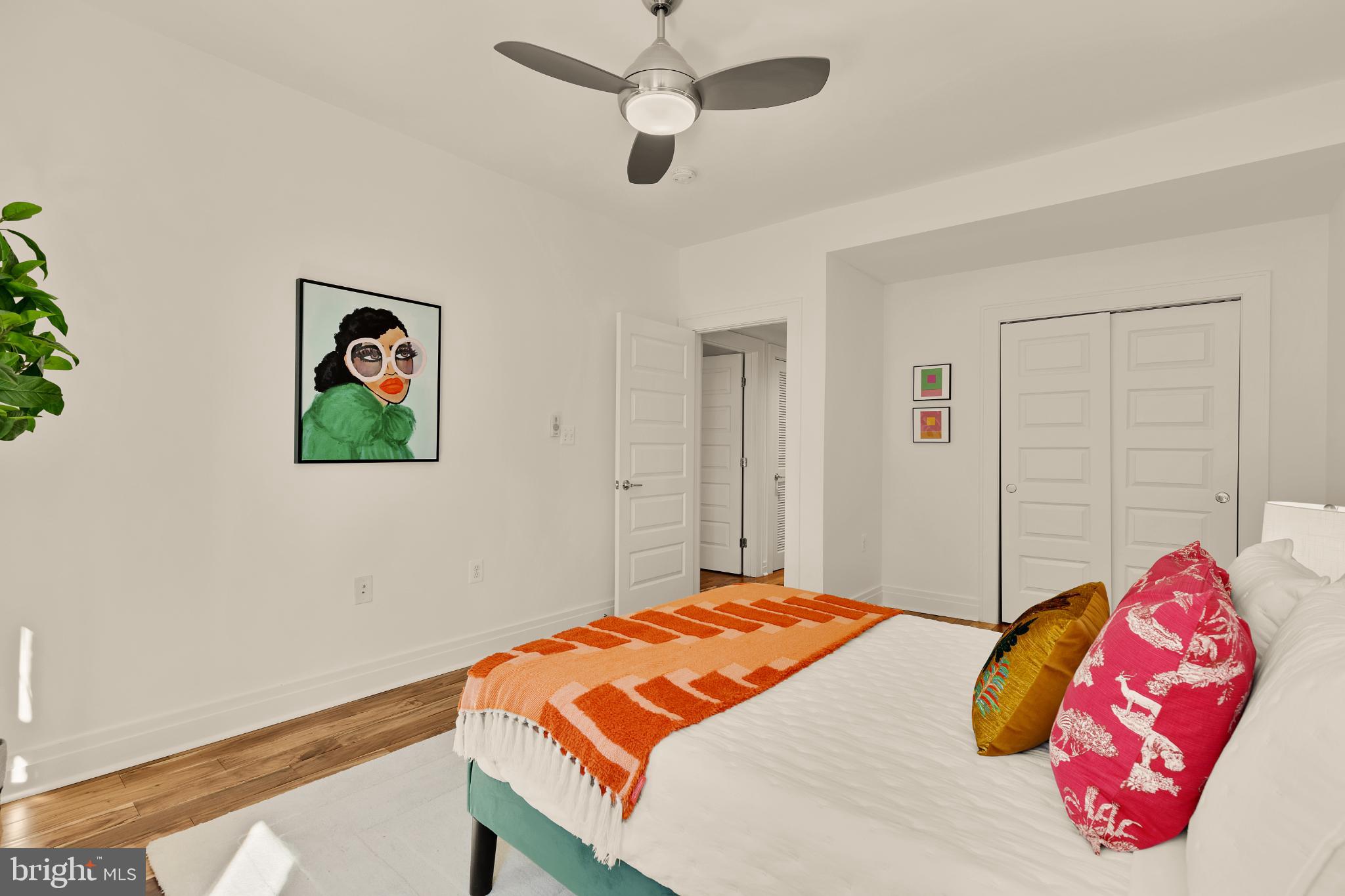 1811 Wyoming Avenue Northwest, Unit 32 Washington, DC 20009 - Photo 21 of 26 a bedroom with a bed and a chandelier