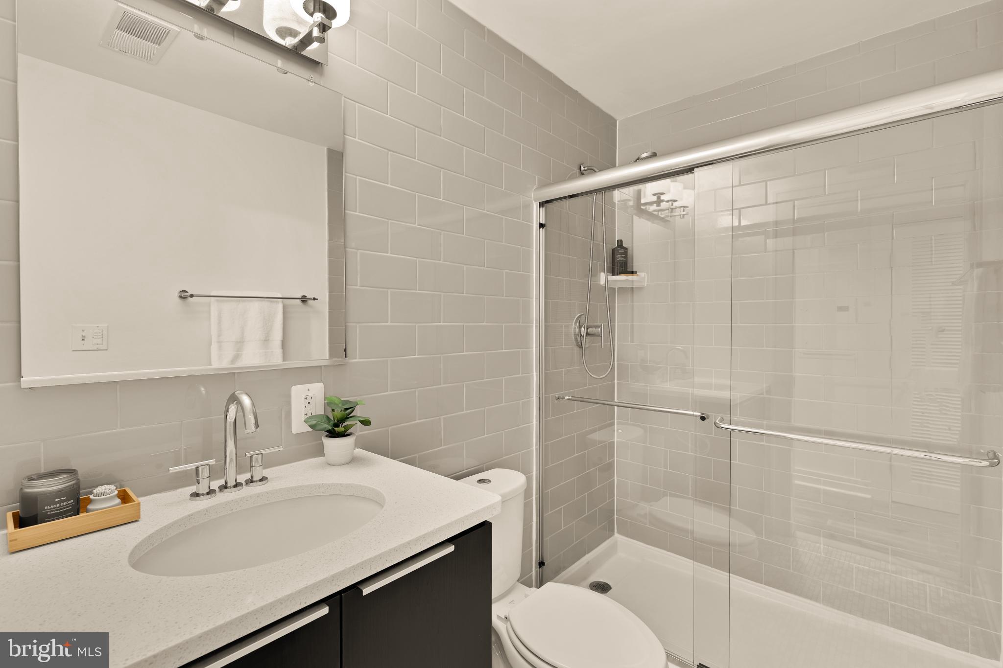 1811 Wyoming Avenue Northwest, Unit 32 Washington, DC 20009 - Photo 22 of 26 a bathroom with a sink toilet and shower