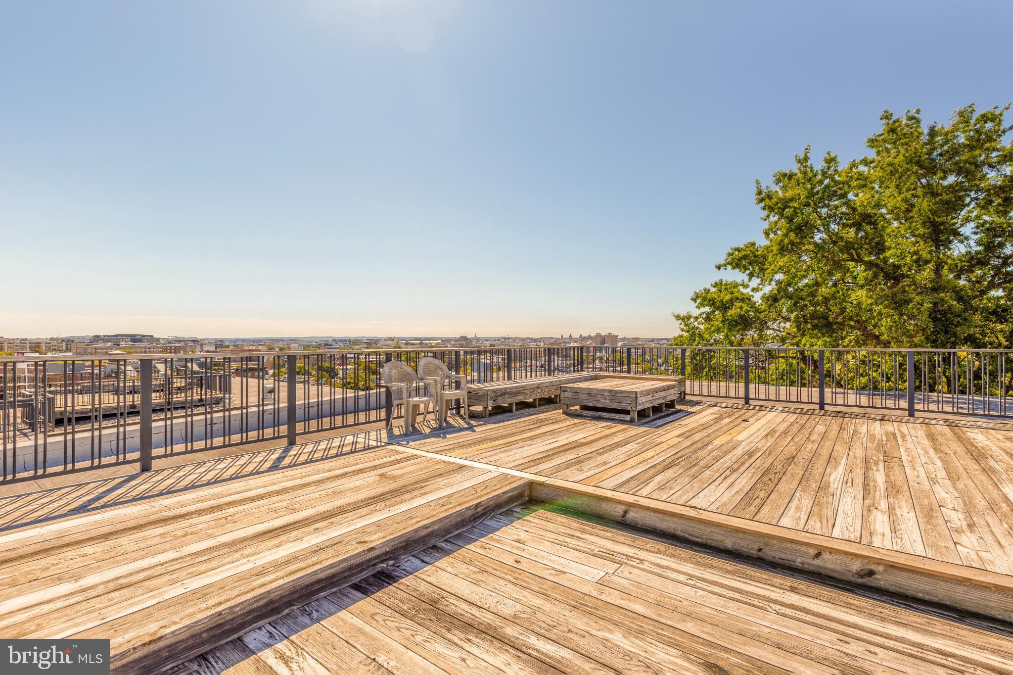 1811 Wyoming Avenue Northwest, Unit 32 Washington, DC 20009 - Photo 24 of 26 a view of a balcony with wooden floor