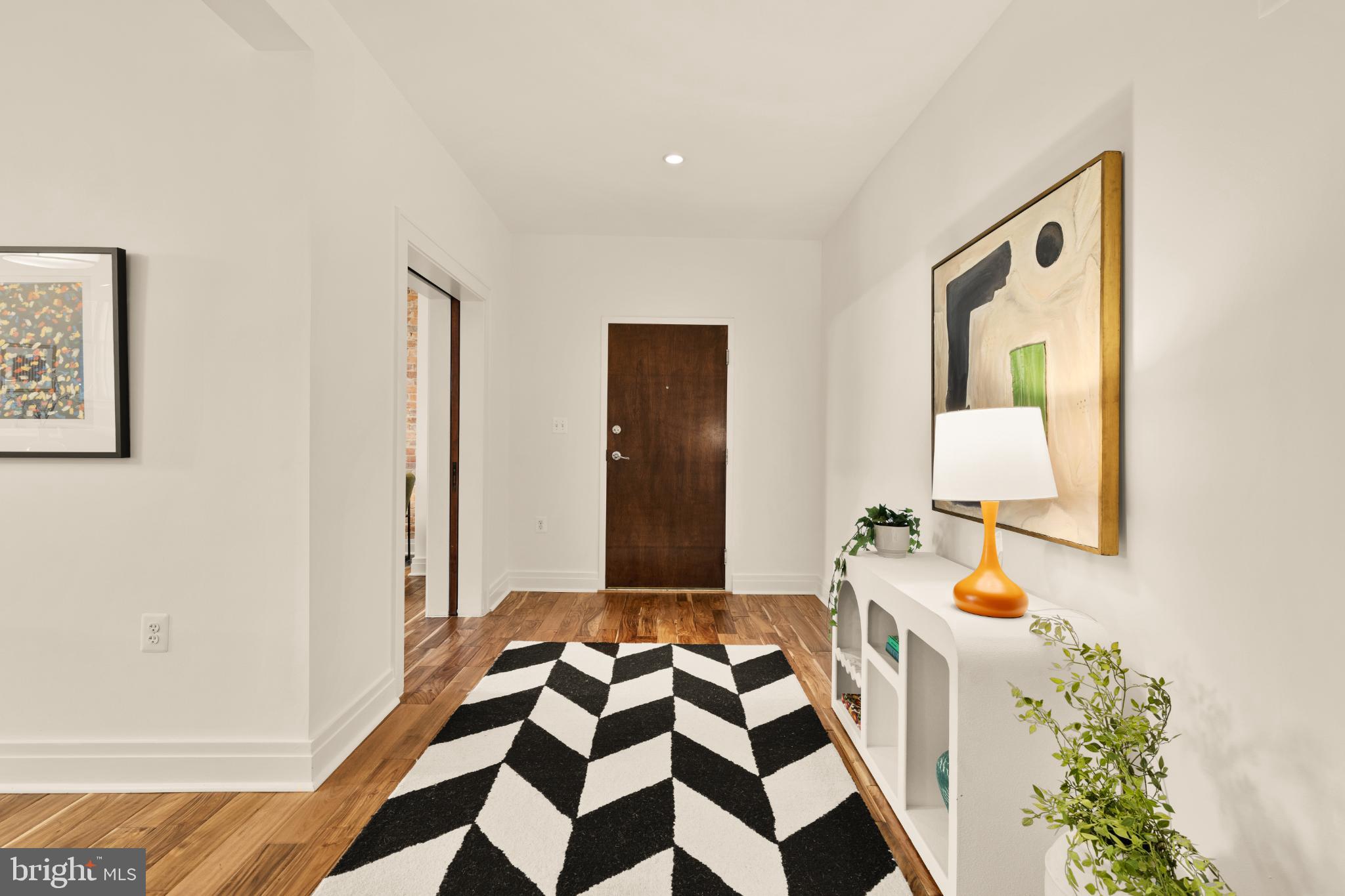 1811 Wyoming Avenue Northwest, Unit 32 Washington, DC 20009 - Photo 5 of 26 a bedroom with a bed and a window