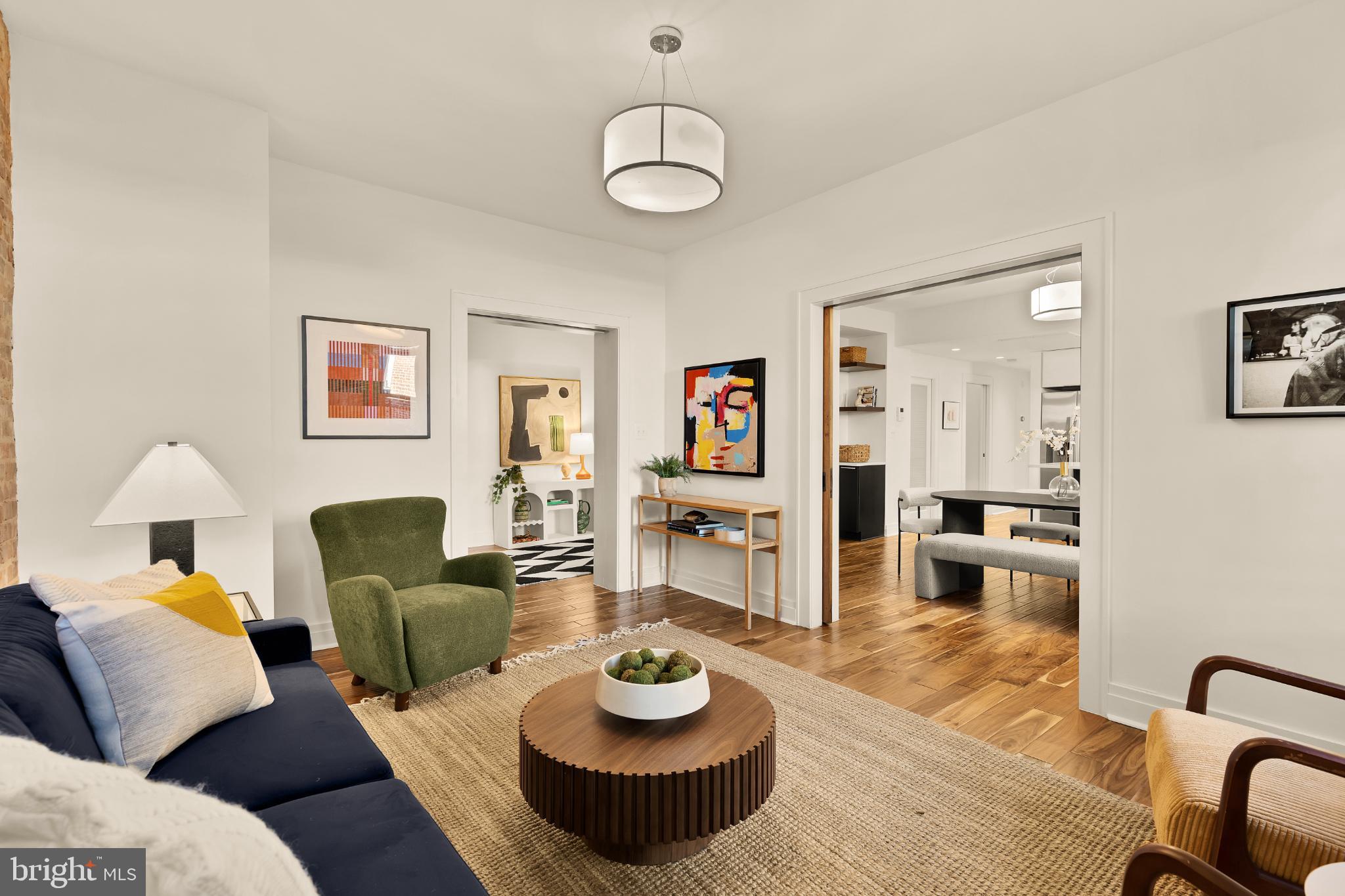 1811 Wyoming Avenue Northwest, Unit 32 Washington, DC 20009 - Photo 9 of 26 a living room with furniture and a wooden floor