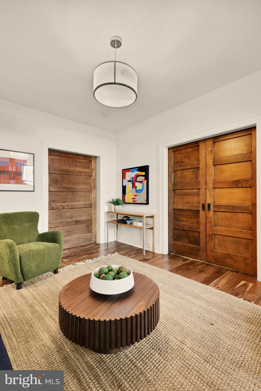1811 Wyoming Avenue Northwest, Unit 32 Washington, DC 20009 - Photo 10 of 26 a living room with furniture and a table