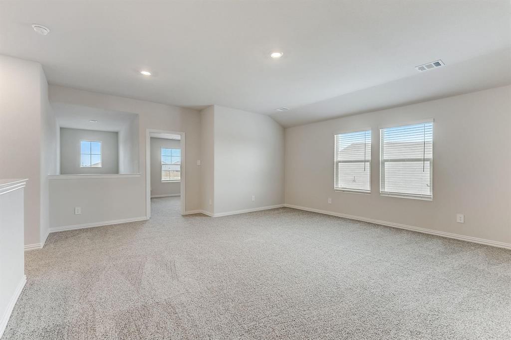 1405 Winters Way McKinney, TX 75071 - Photo 25 of 32 Empty room with light colored carpet