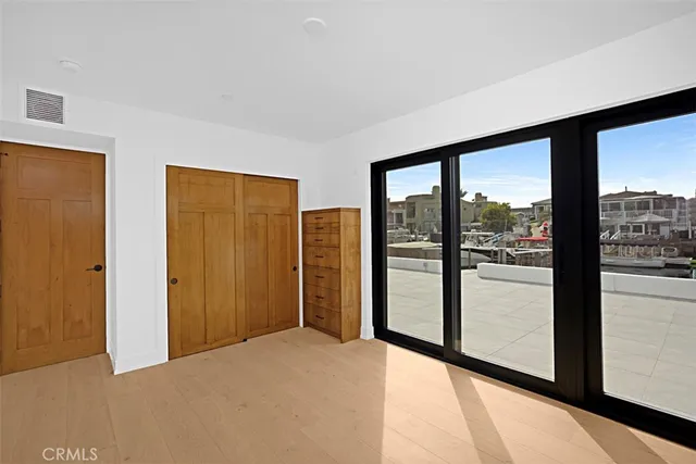 a view of empty room with floor to ceiling window