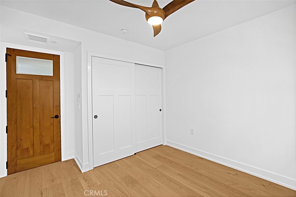 4017 Channel Place, Unit A Newport Beach, CA 92663 - Photo 7 of 18 a view of a room with wooden floor and closet