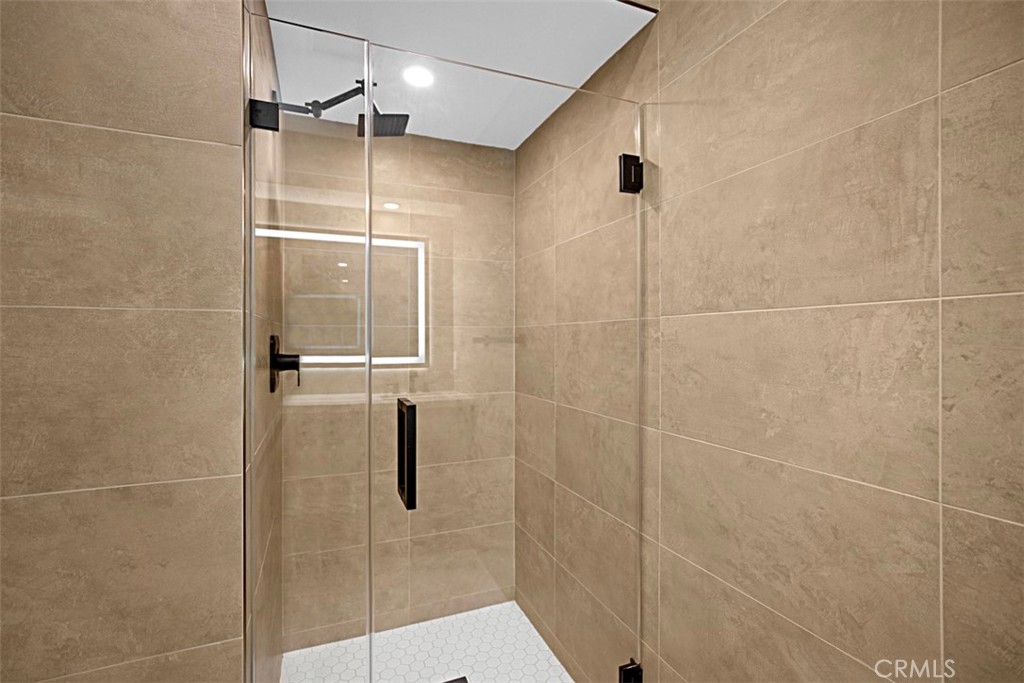 4017 Channel Place, Unit A Newport Beach, CA 92663 - Photo 9 of 18 a bathroom with a shower