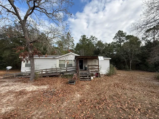 a house view with a backyard space