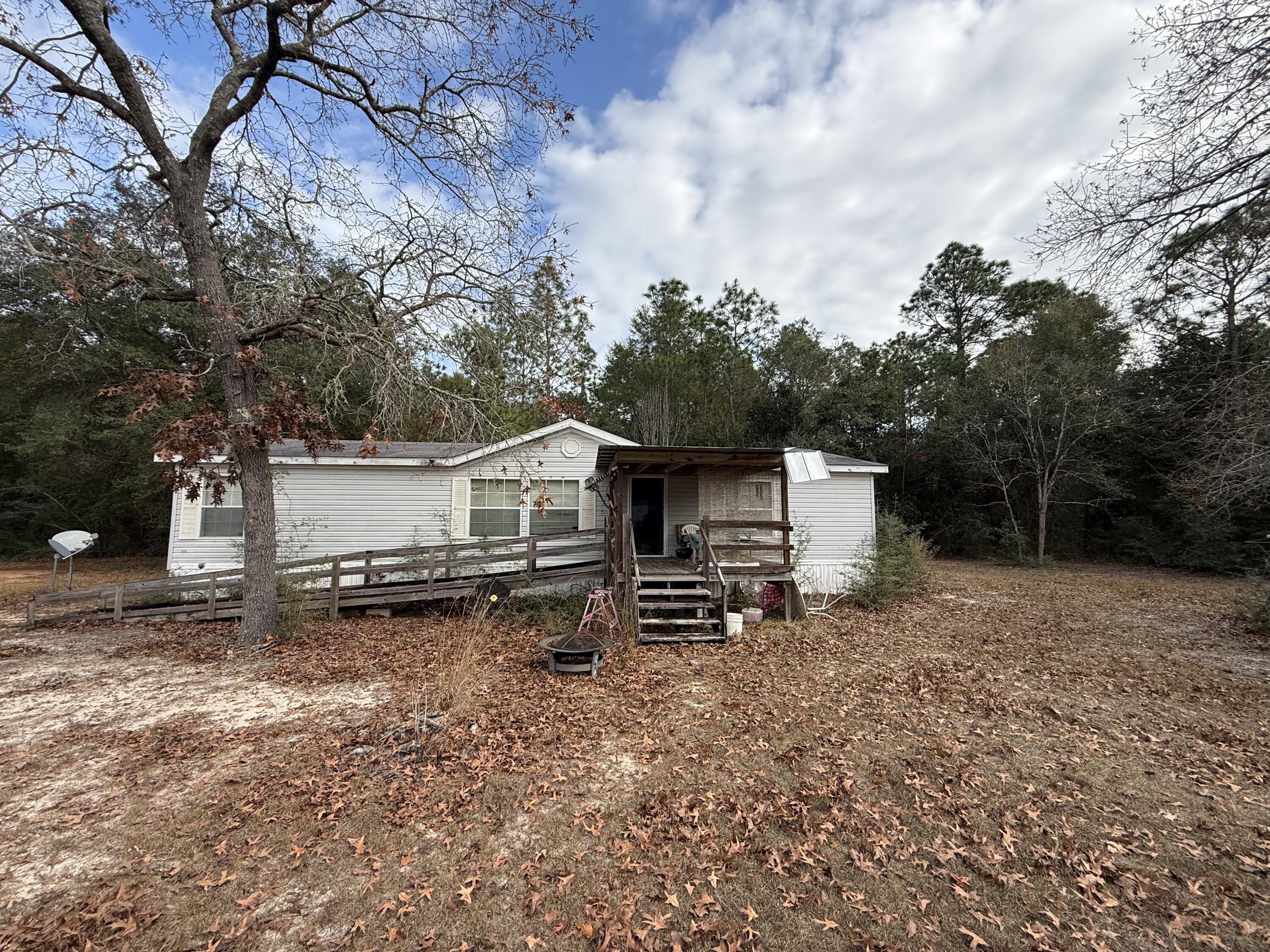 a house view with a backyard space