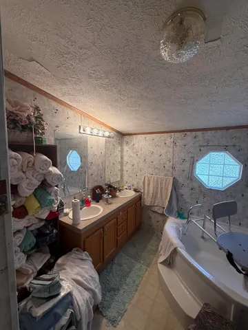 a bathroom with a toilet sink and shower curtain