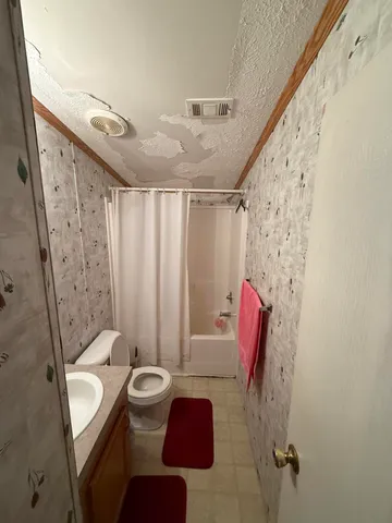 a bedroom with bed and window