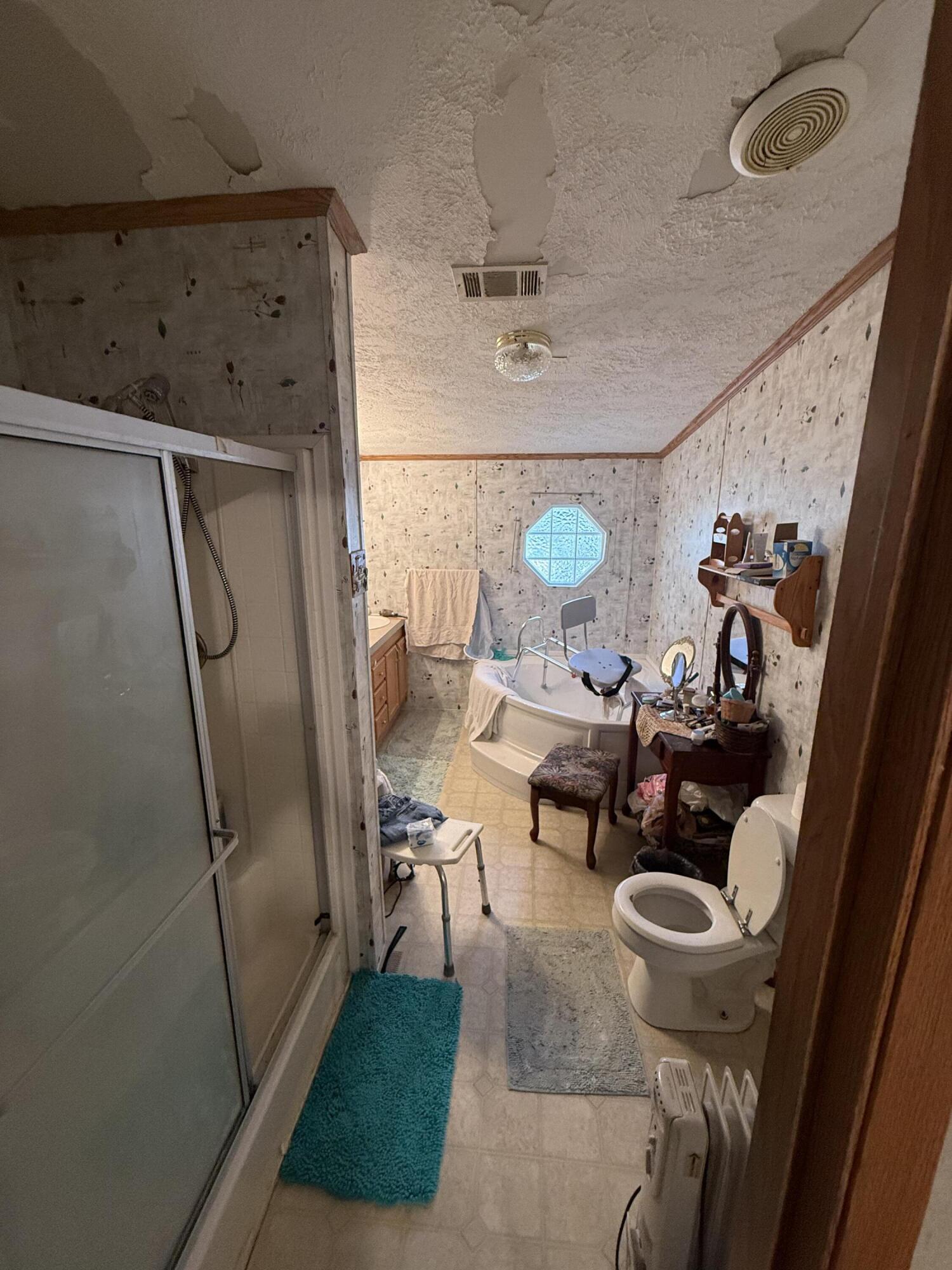 12297 Cooper Road Holt, FL 32564 - Photo 15 of 17 a living room with furniture and a floor to ceiling window