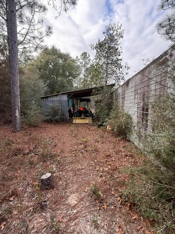 a view of outdoor space with deck and barbeque oven