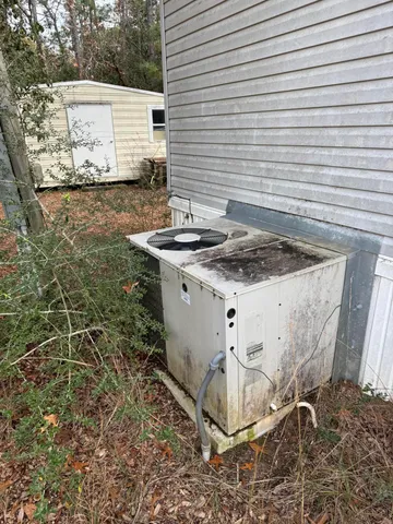 a view of a backyard with table and chairs