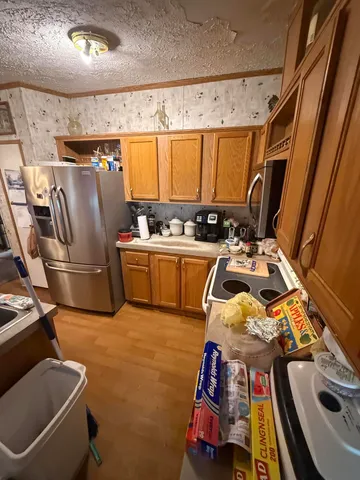 a storage room with sink washer and dryer