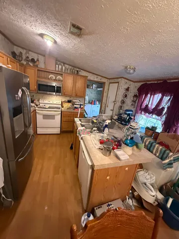 a living room with lots of furniture and a chandelier