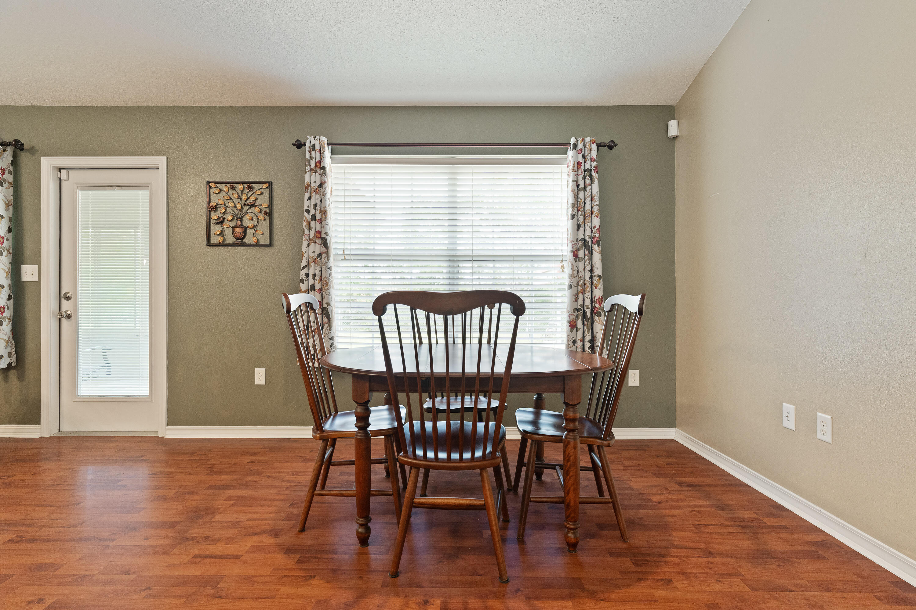 6100 Buckward Road Baker, FL 32531 - Photo 31 of 55 a view of a dining room with furniture window and wooden floor