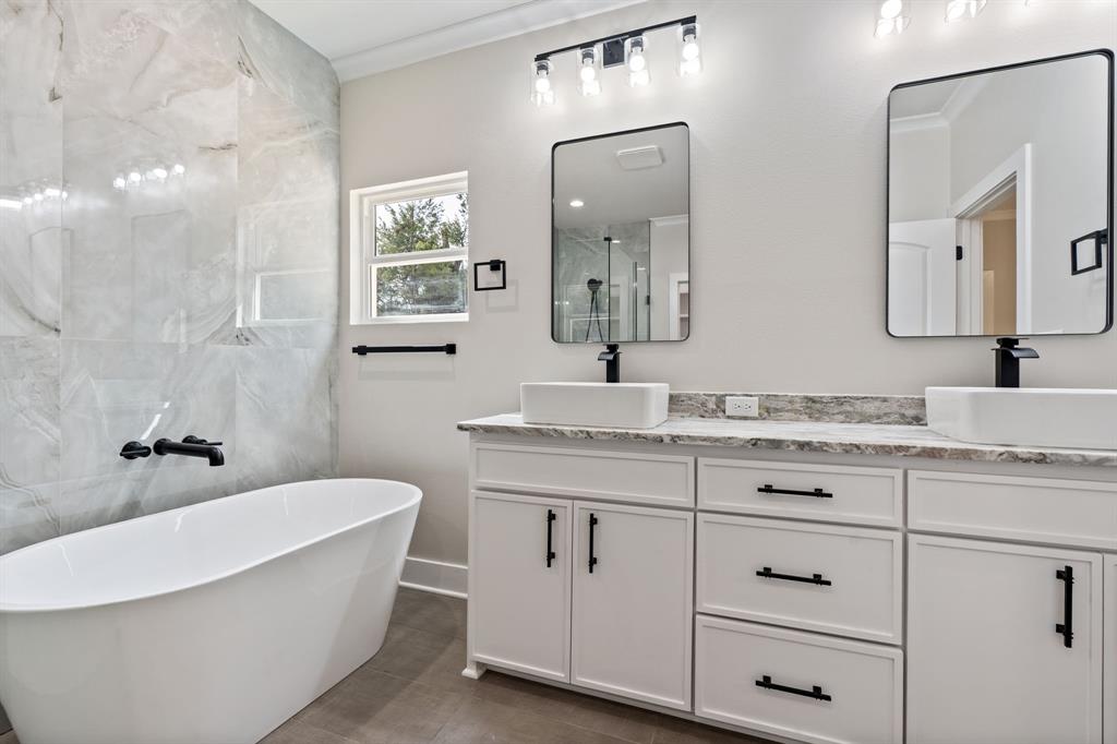 335 Perdanales Bullard, TX 75757 - Photo 25 of 37 a bathroom with a granite countertop sink mirror and bathtub