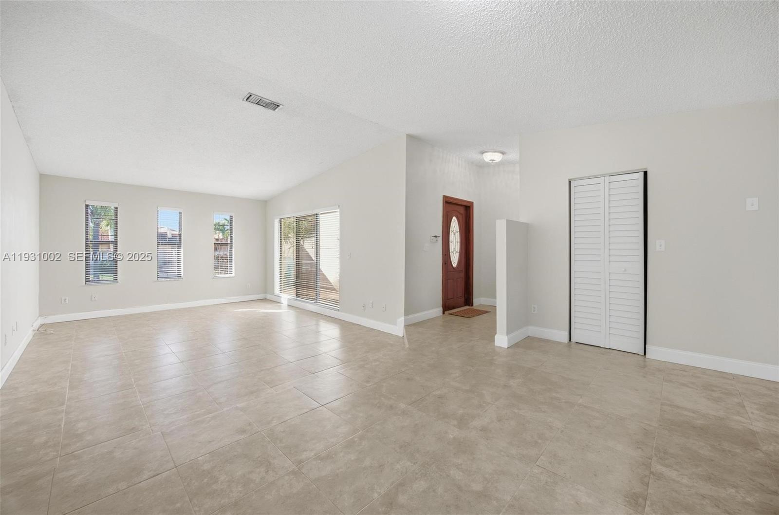 11731 Southwest 112th Terrace Miami, FL 33186 - Photo 13 of 41 a view of an empty room with window