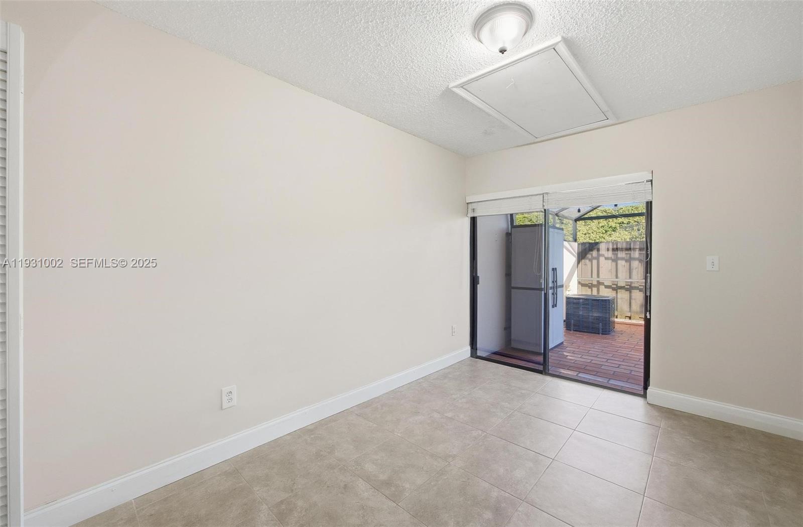 11731 Southwest 112th Terrace Miami, FL 33186 - Photo 23 of 41 an empty room with entrance and door