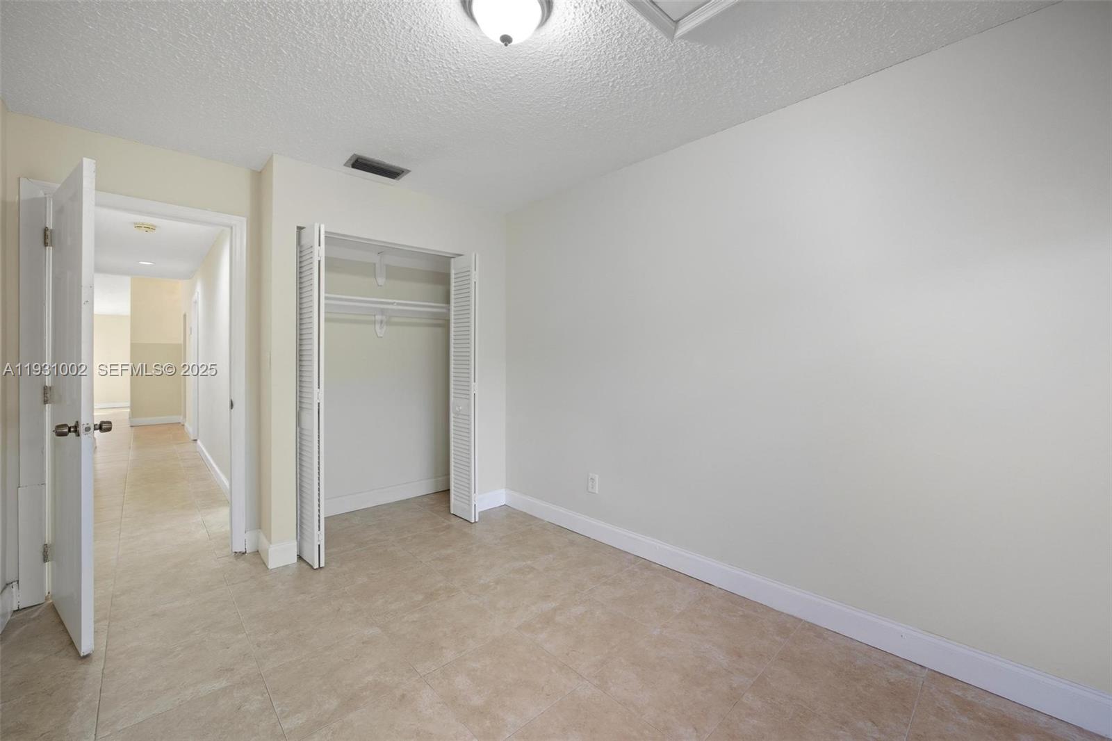 11731 Southwest 112th Terrace Miami, FL 33186 - Photo 24 of 41 an empty room with a bathroom