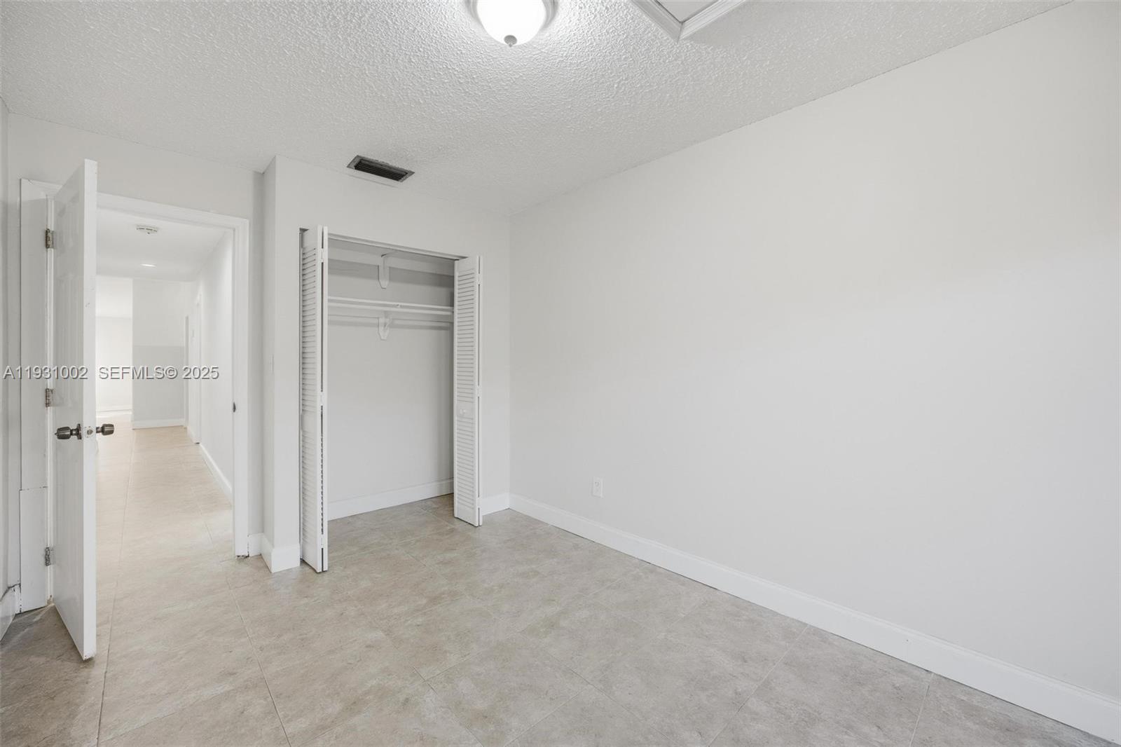 11731 Southwest 112th Terrace Miami, FL 33186 - Photo 25 of 41 an empty room with a empty space