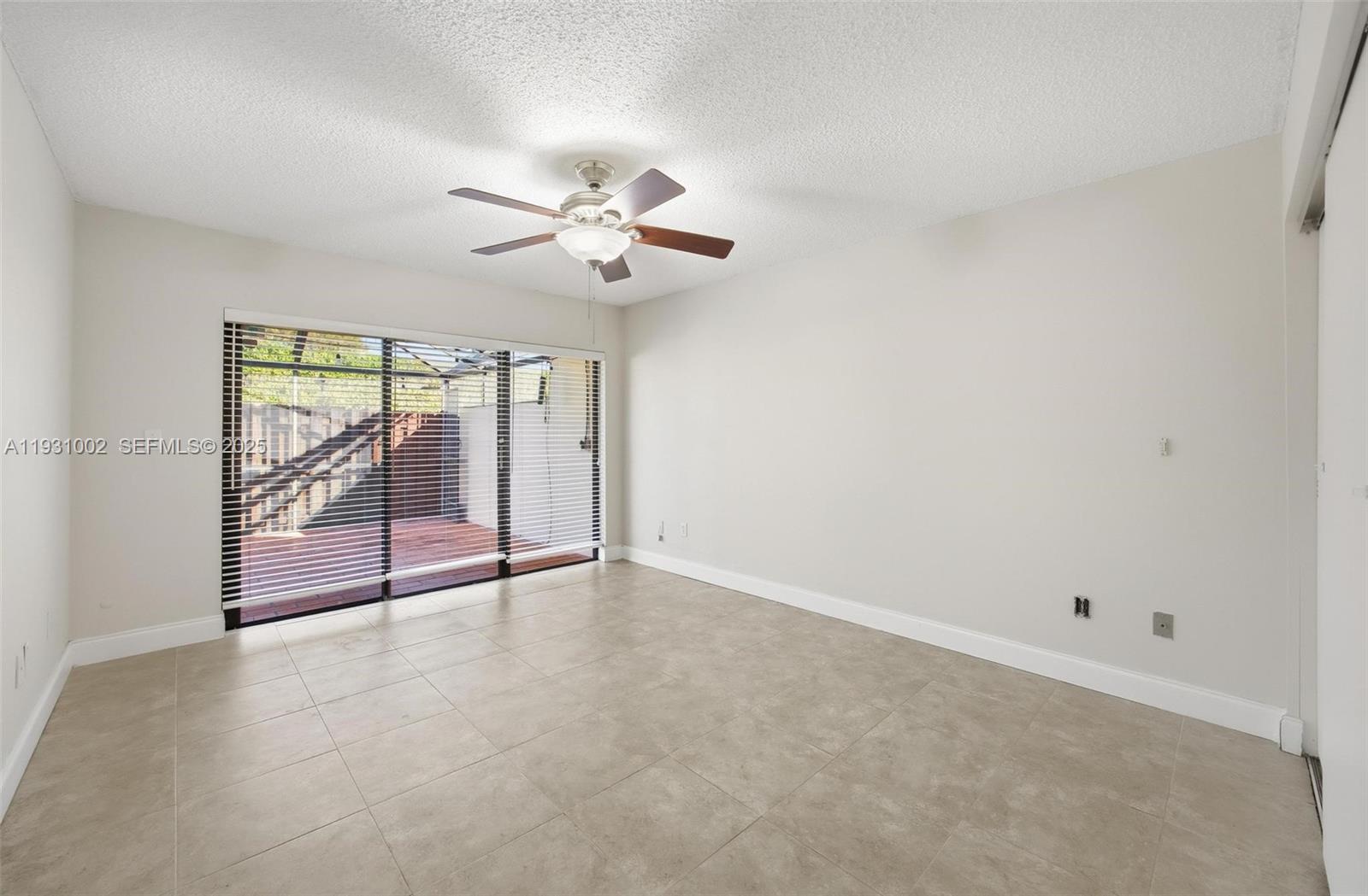 11731 Southwest 112th Terrace Miami, FL 33186 - Photo 27 of 41 wooden floor in an empty room with a window