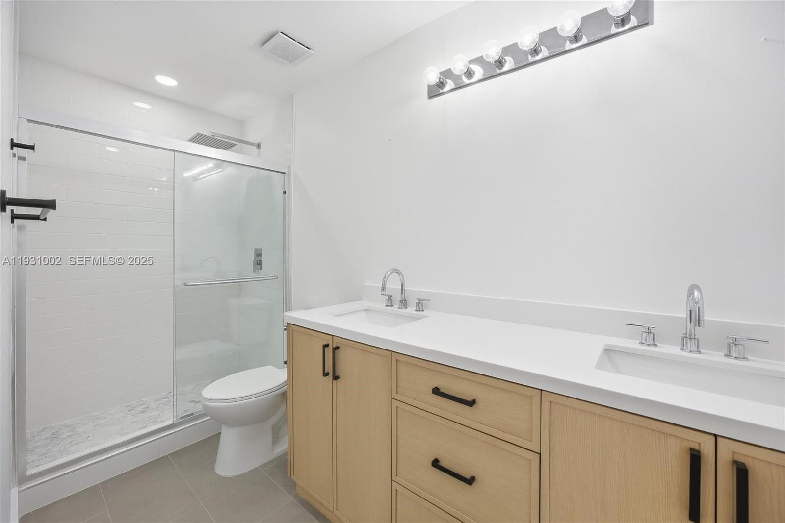 11731 Southwest 112th Terrace Miami, FL 33186 - Photo 30 of 41 a bathroom with a sink a toilet and shower