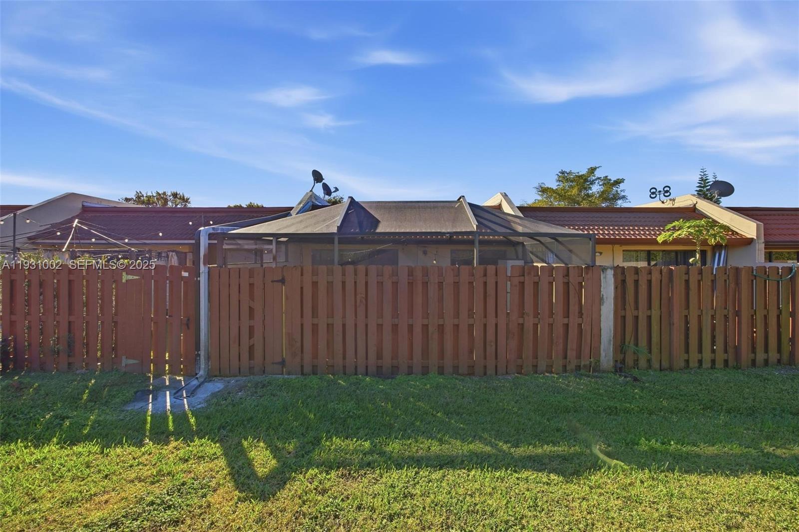11731 Southwest 112th Terrace Miami, FL 33186 - Photo 37 of 41 a view of a backyard with wooden fence