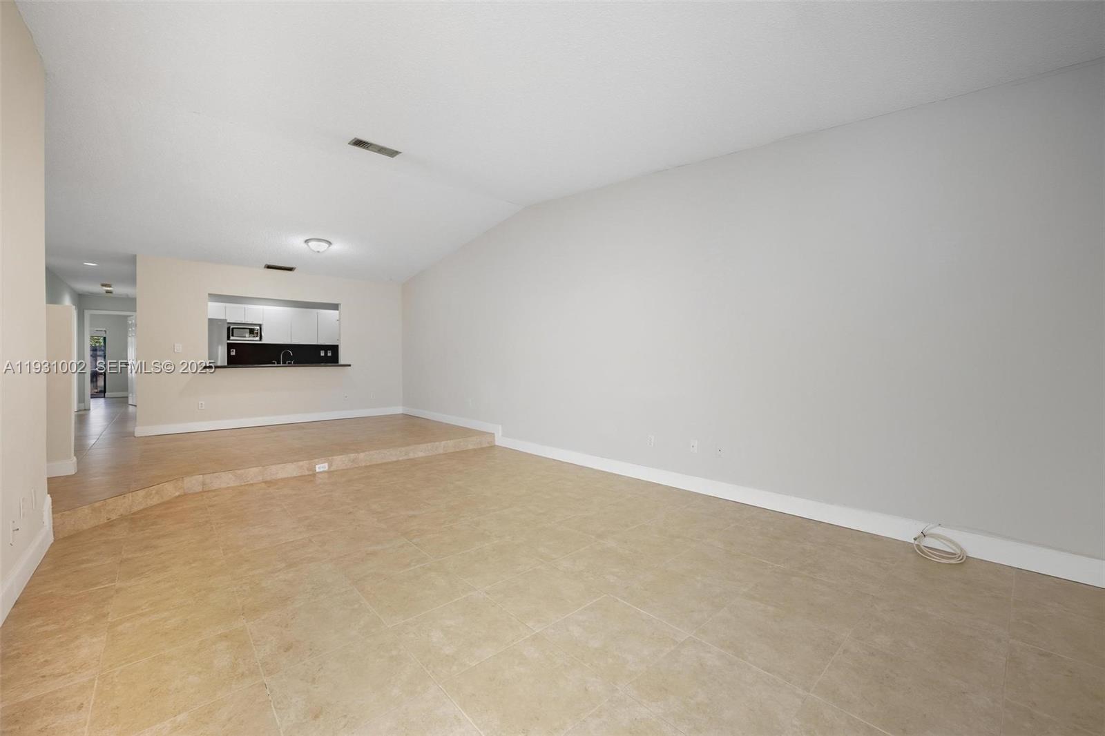 11731 Southwest 112th Terrace Miami, FL 33186 - Photo 8 of 41 a view of a livingroom and a fireplace