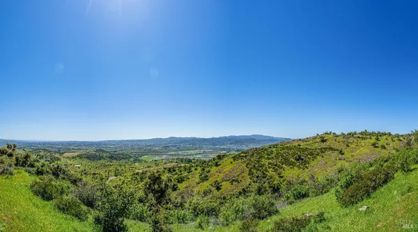 a view of mountain view with mountains in the background