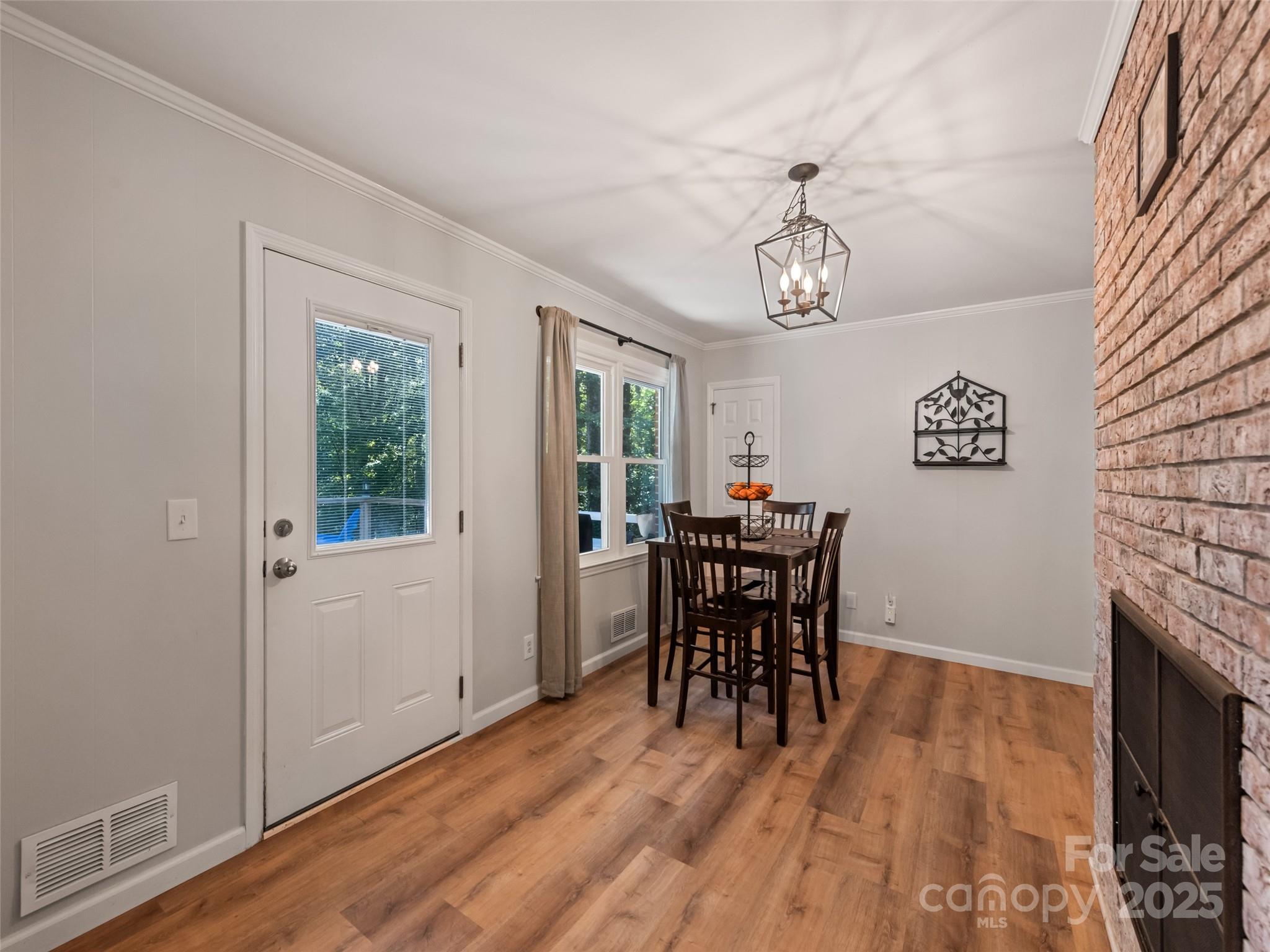 263 Blanton Street Columbus, NC 28722 - Photo 19 of 45 a view of a dining room with furniture window and wooden floor