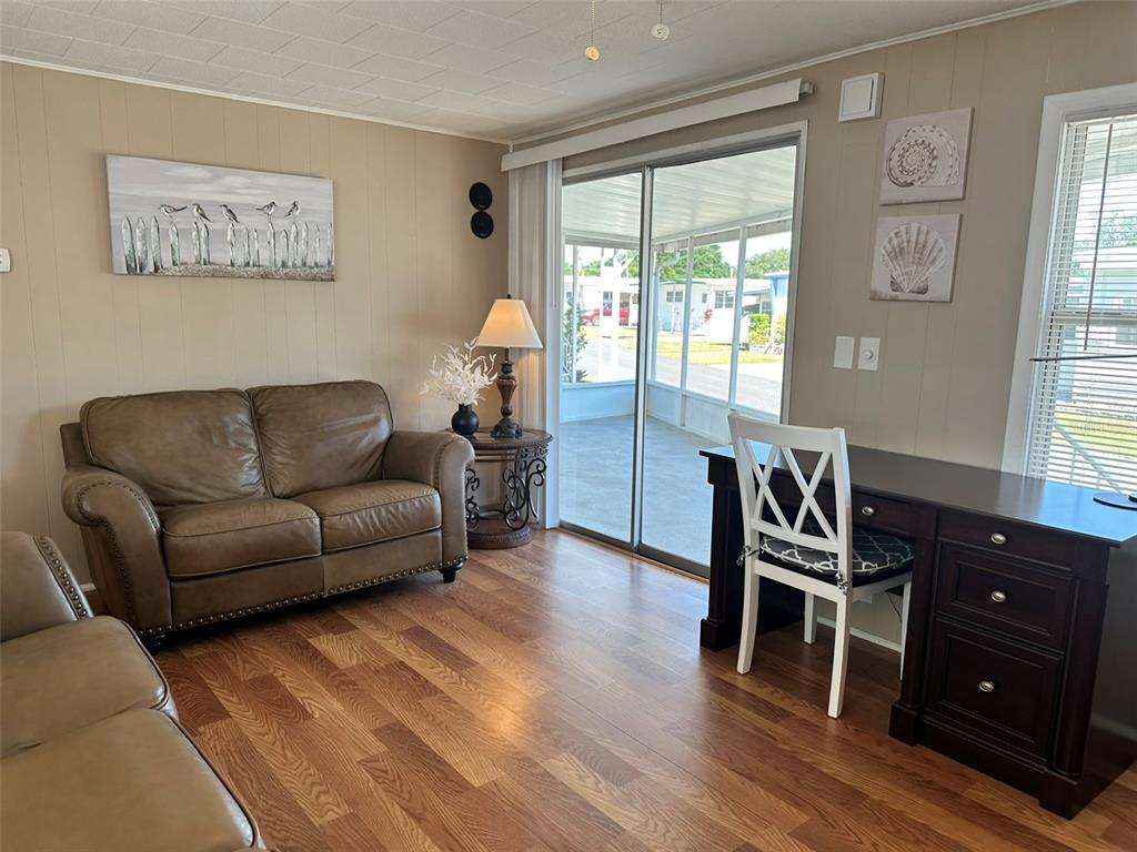 1600 Old Coachman Rd., Unit 816 Clearwater, FL 33765 - Photo 12 of 26 a living room with furniture and wooden floor