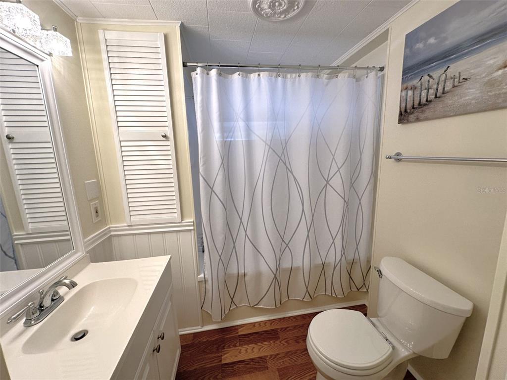 1600 Old Coachman Rd., Unit 816 Clearwater, FL 33765 - Photo 23 of 26 a bathroom with a sink toilet and shower