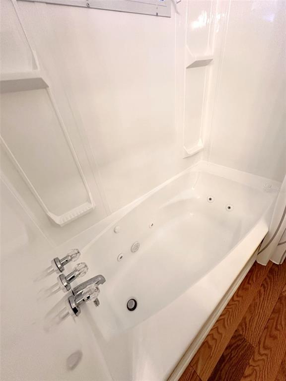 1600 Old Coachman Rd., Unit 816 Clearwater, FL 33765 - Photo 24 of 26 a bathroom with a tub