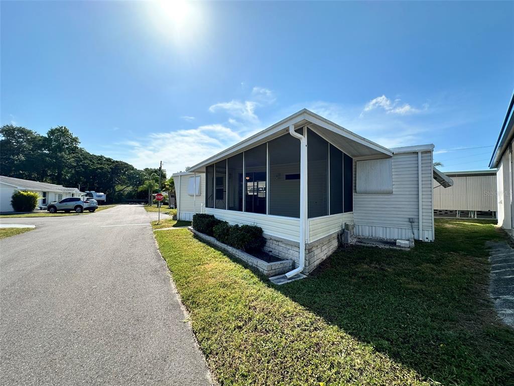 1600 Old Coachman Rd., Unit 816 Clearwater, FL 33765 - Photo 6 of 26 a view of house with yard outdoor seating and entertaining space
