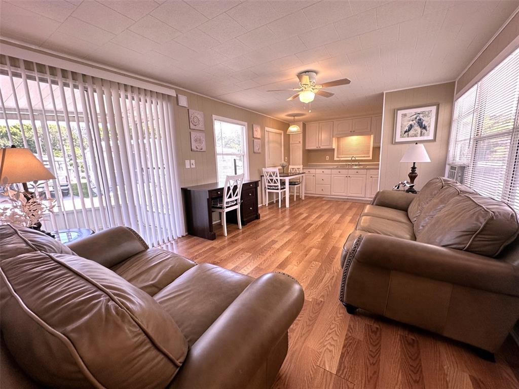 1600 Old Coachman Rd., Unit 816 Clearwater, FL 33765 - Photo 10 of 26 a living room with furniture and a large window