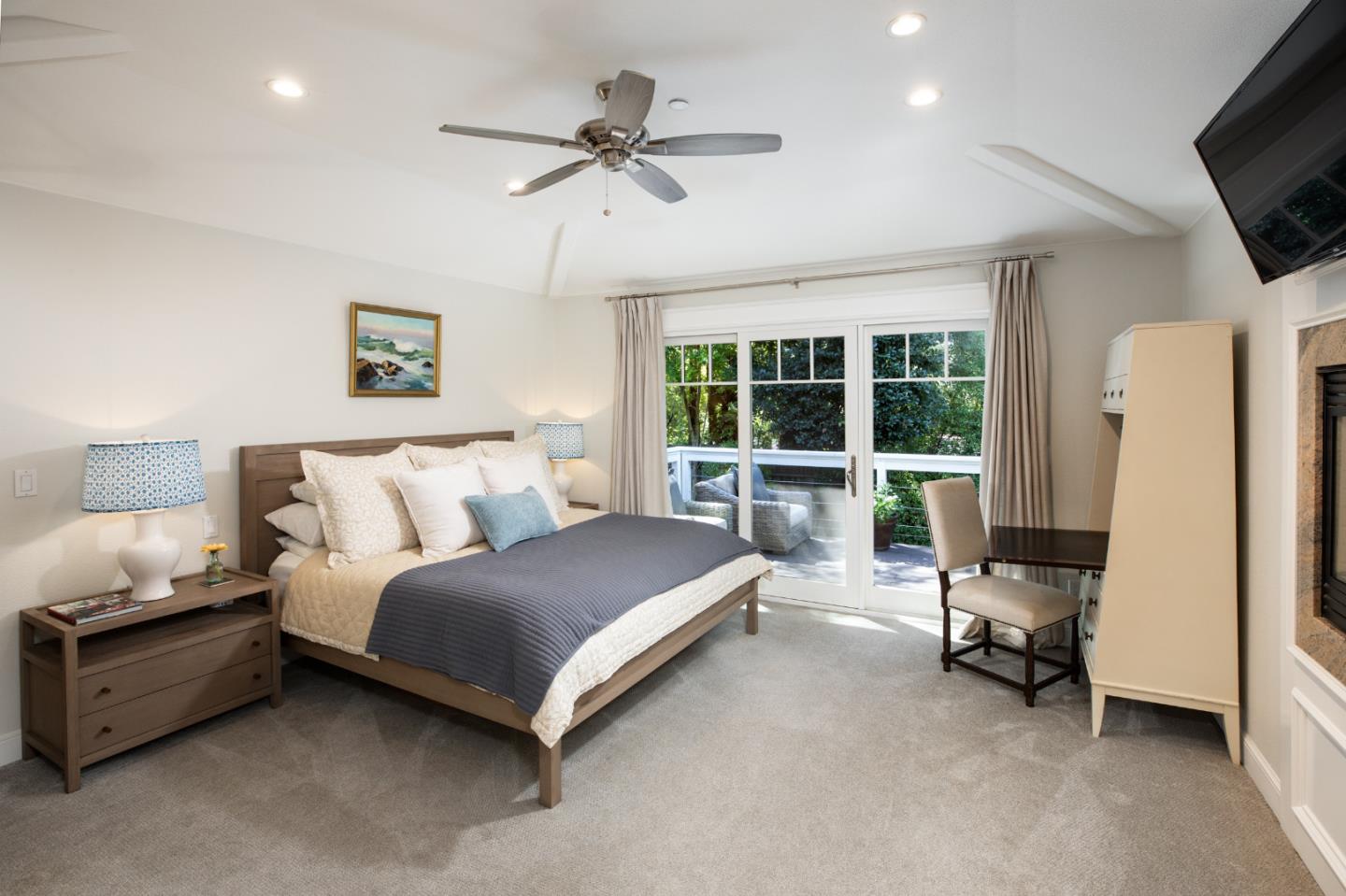 63 Ridge Court Woodside, CA 94062 - Photo 12 of 31 a spacious bedroom with a bed and a flat tv screen