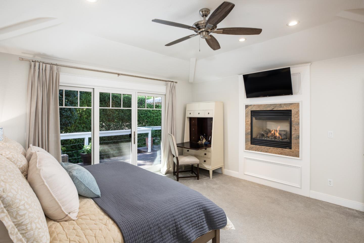 63 Ridge Court Woodside, CA 94062 - Photo 13 of 31 a bedroom with a bed and a flat screen tv