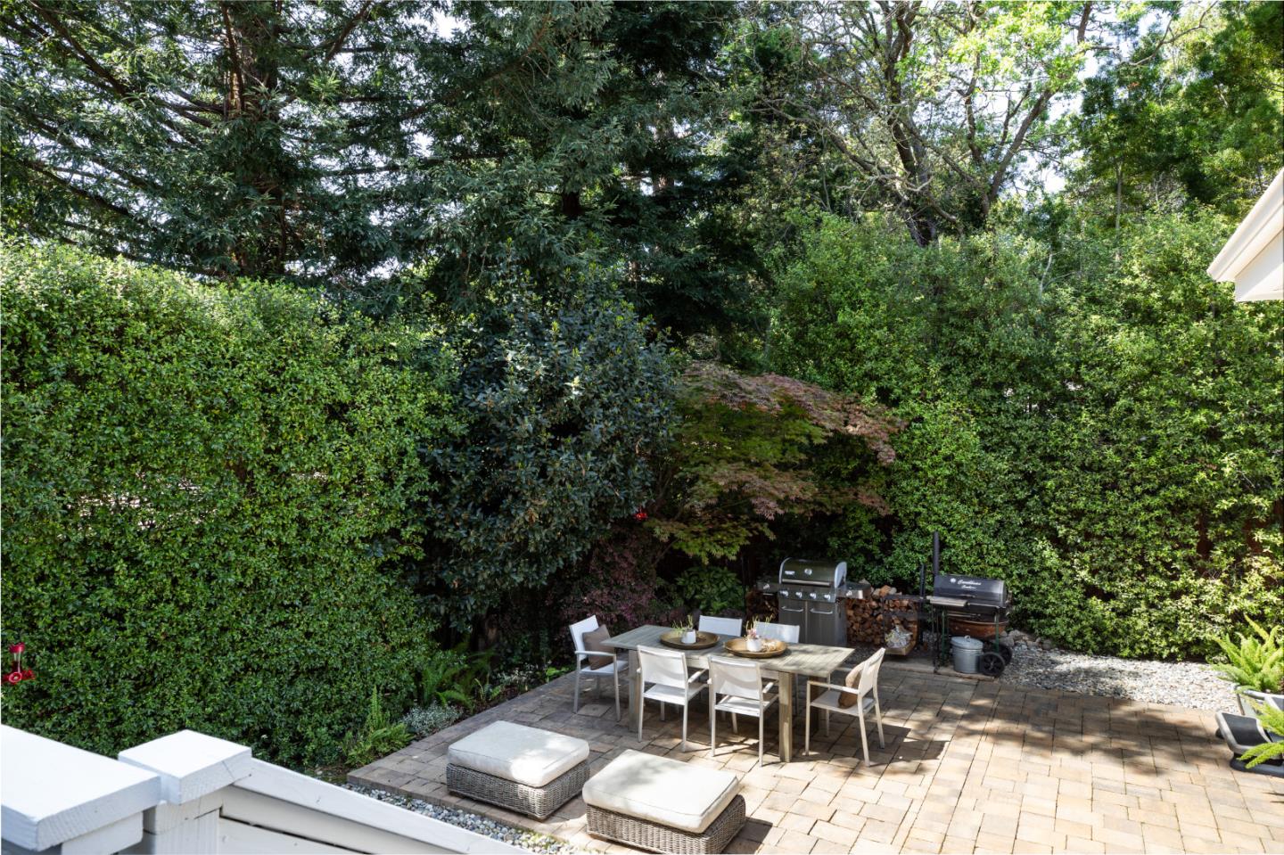 63 Ridge Court Woodside, CA 94062 - Photo 22 of 31 a view of backyard with a table and chairs and potted plants