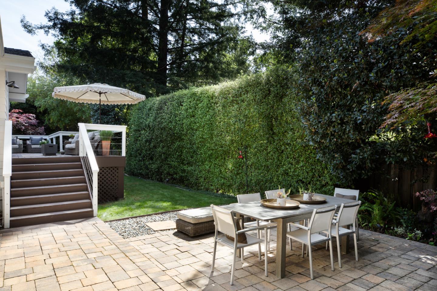 63 Ridge Court Woodside, CA 94062 - Photo 23 of 31 a backyard of a house with a table and chairs