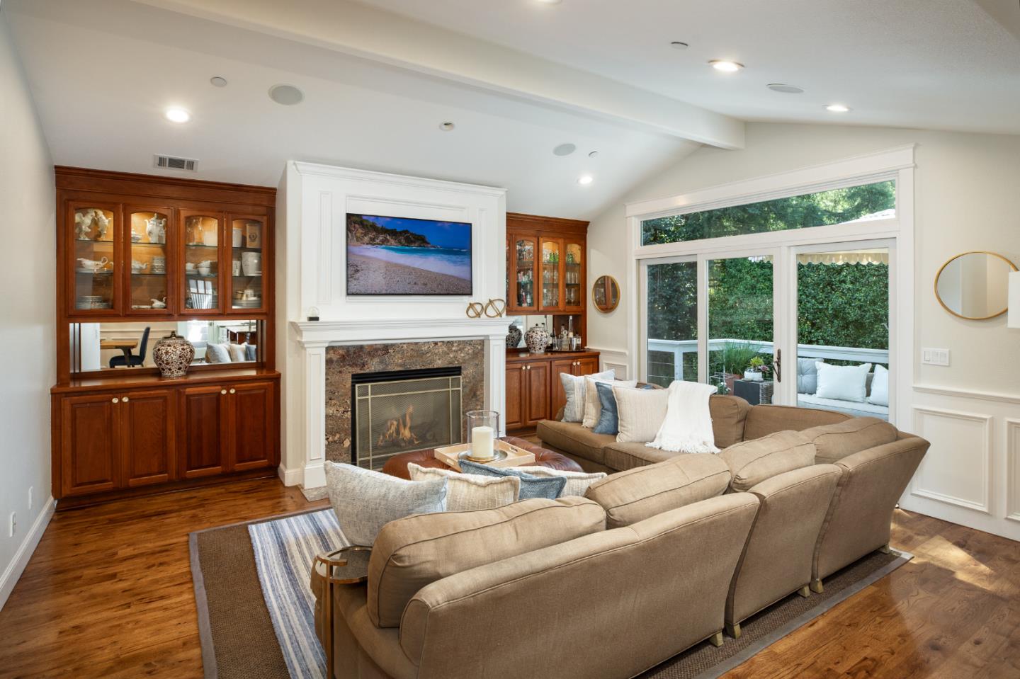 63 Ridge Court Woodside, CA 94062 - Photo 5 of 31 a living room with furniture a fireplace and a floor to ceiling window