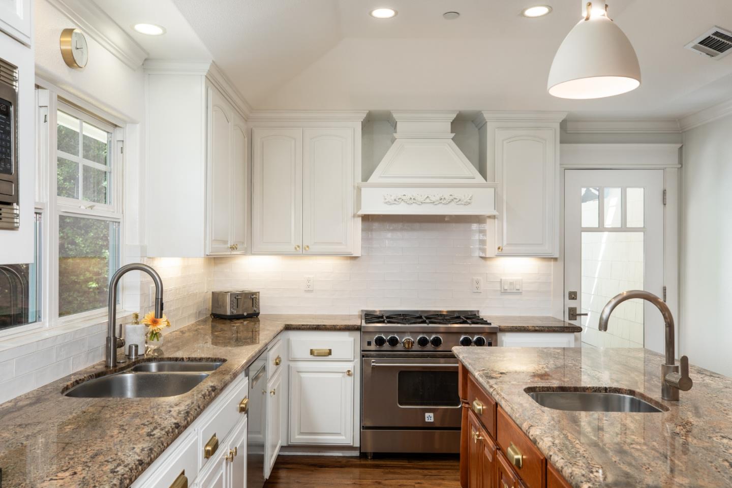 63 Ridge Court Woodside, CA 94062 - Photo 9 of 31 a kitchen with kitchen island granite countertop a sink stainless steel appliances and cabinets