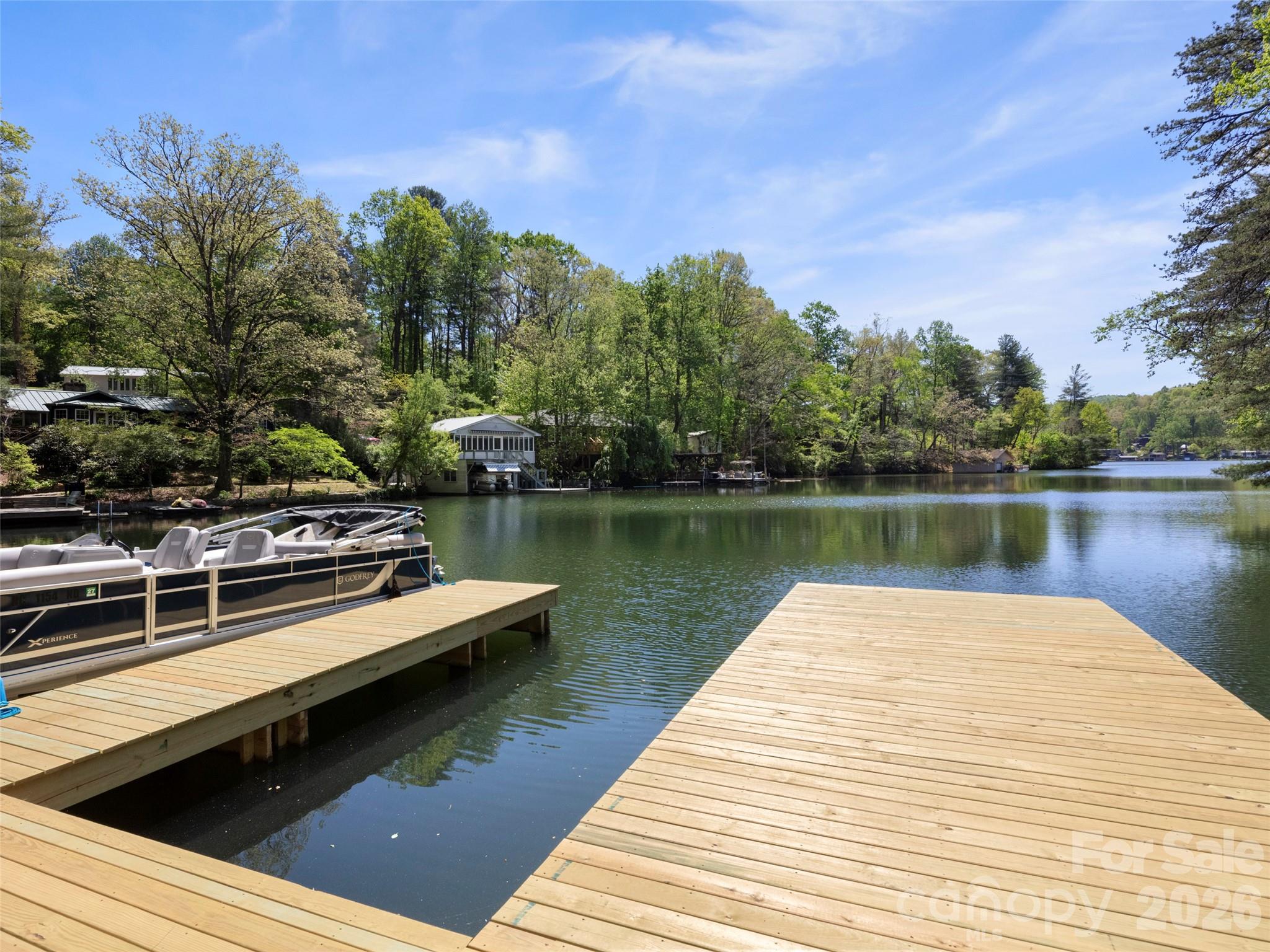 99999 North Lake Summit Road Zirconia, NC 28790 - Photo 5 of 18 a wooden pier with boats in a lake