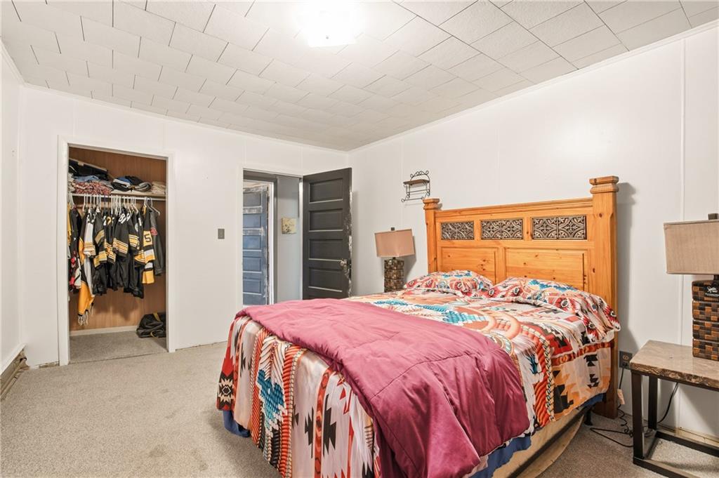 1008 Main Street Berlin, PA 15530 - Photo 23 of 38 a bedroom with a bed and a walk in closet