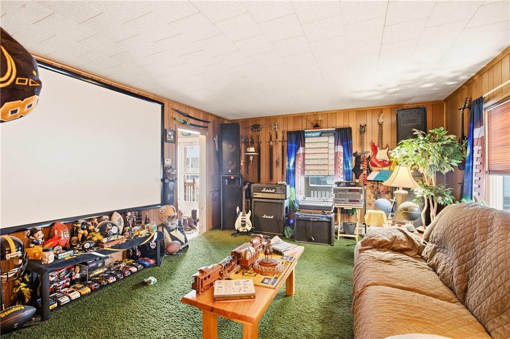 1008 Main Street Berlin, PA 15530 - Photo 5 of 38 a living room with furniture and a flat screen tv