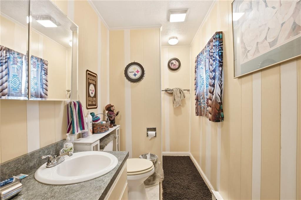 1008 Main Street Berlin, PA 15530 - Photo 10 of 38 a bathroom with a sink and a mirror