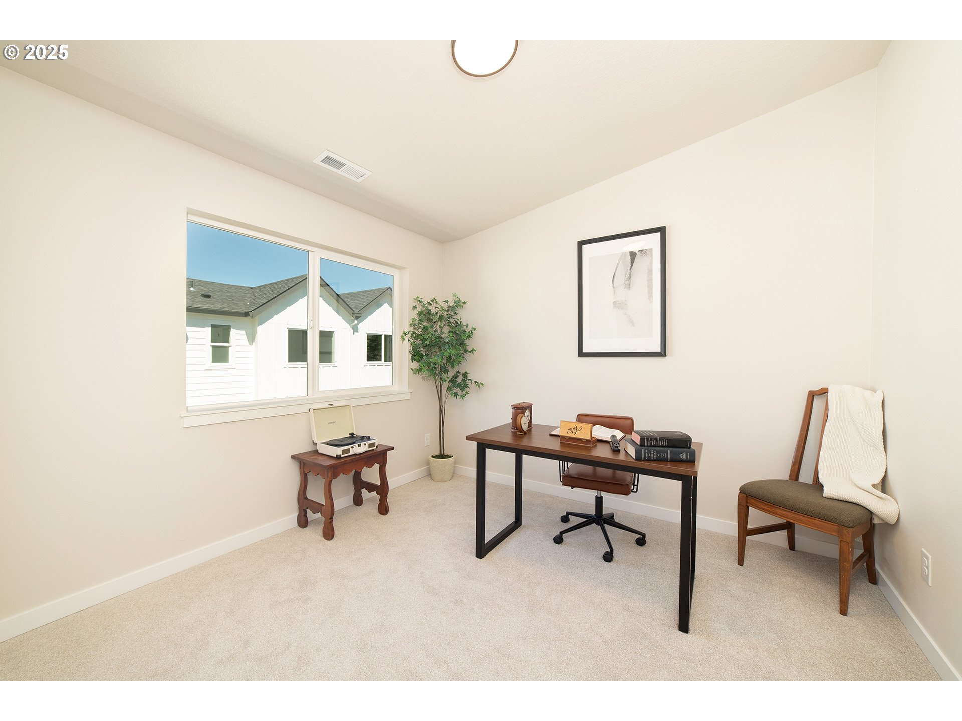 1671 Southeast Sherrett Street Portland, OR 97202 - Photo 12 of 16 a living room with furniture and a window