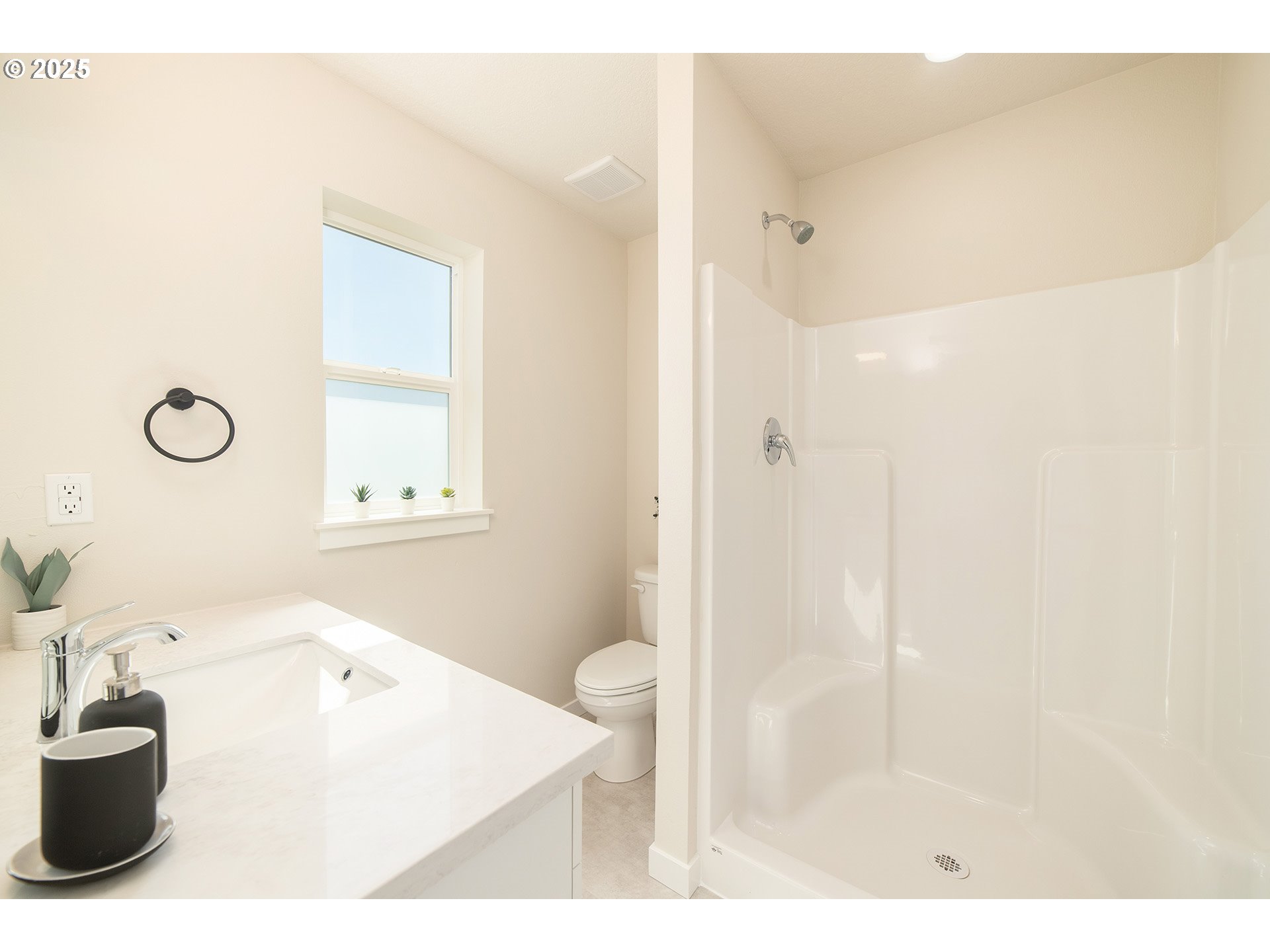1671 Southeast Sherrett Street Portland, OR 97202 - Photo 10 of 16 a bathroom with a sink a toilet and shower