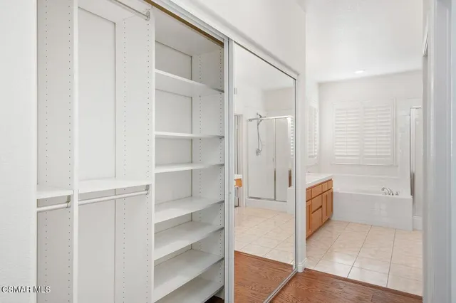 a bathroom with a tub and shower