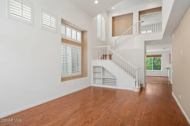 a view of an entryway with wooden floor